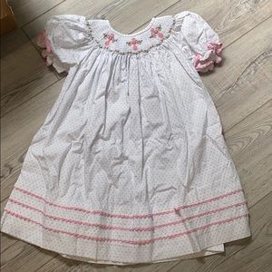 smocked Cukees dress with embroidery crosses